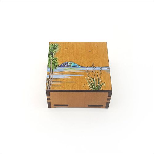 Small square trinket box featuring Mt Maunganui print, crafted from NZ Silver Beech and inlaid Paua for elegance.