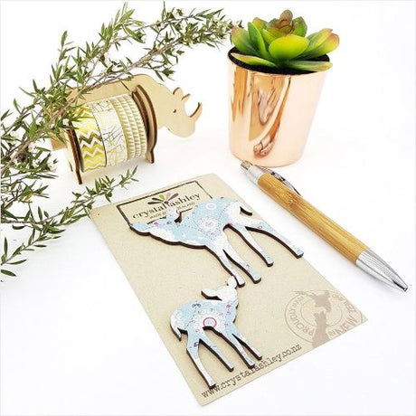 Whimsical blue Bambi wall art featuring playful mini shapes, perfect for nurseries and children's rooms.