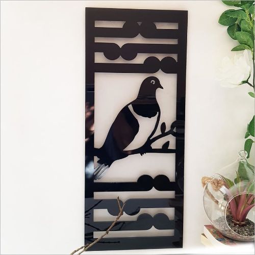 Kiwiana wall art panel featuring black Kereru and Koru design, perfect for indoor or outdoor decoration.