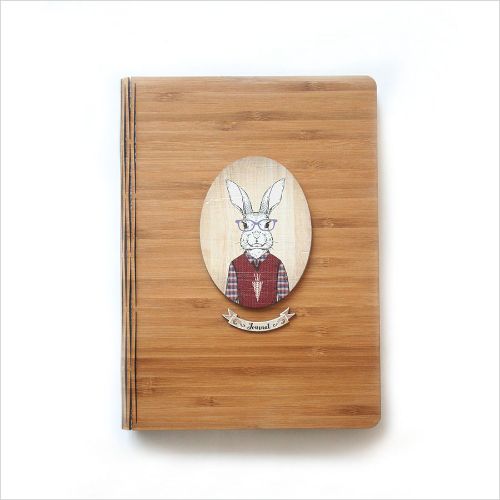 Eco-friendly bamboo journal featuring intricate rabbit design, perfect for writing, sketching, or journaling.