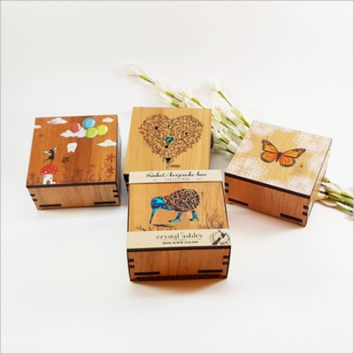 Charming square wooden trinket box with fern design and NZ paua inlay, ideal for jewelry and keepsakes.