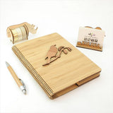 Bamboo Journal featuring Tui on Kowhai design, eco-friendly, 120 pages of premium paper, perfect for writing and sketching.