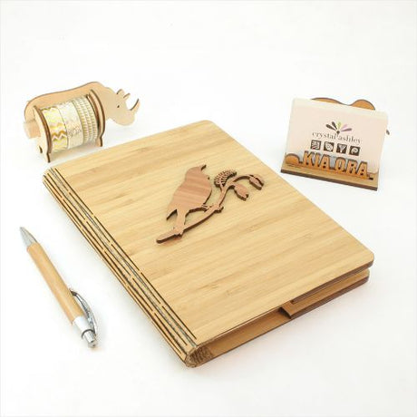 Bamboo Journal featuring Tui on Kowhai design, eco-friendly, 120 pages of premium paper, perfect for writing and sketching.