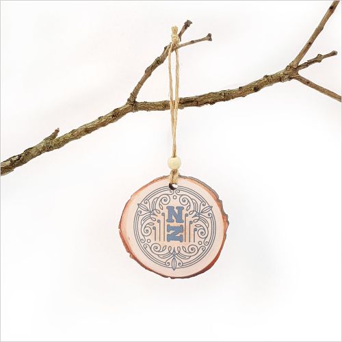 Wood Slice Ornament featuring intricate laser-cut designs, perfect for Christmas trees and sustainable holiday decor.