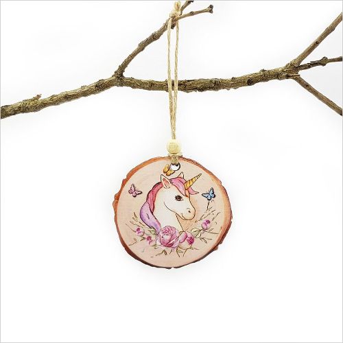 Wood slice ornament featuring a whimsical unicorn design, perfect for Christmas decor or thoughtful gifting.