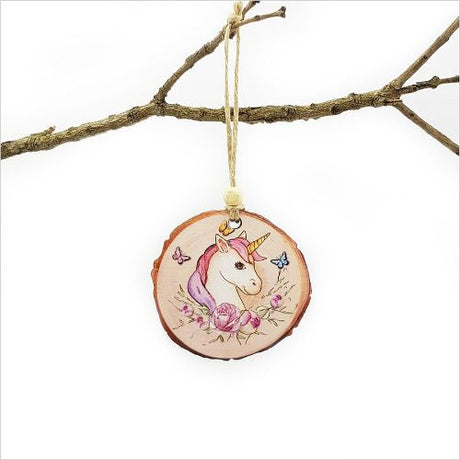 Wood slice ornament featuring a whimsical unicorn design, perfect for Christmas decor or thoughtful gifting.