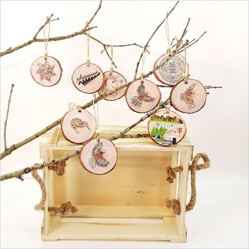 Rustic wood slice ornament featuring kiwi design, 80mm x 75mm, perfect for Christmas trees and year-round decor.