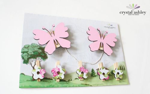 Colorful Butterfly Art Pegs featuring pink butterflies and patterned flower pegs, perfect for displaying kids' artwork.