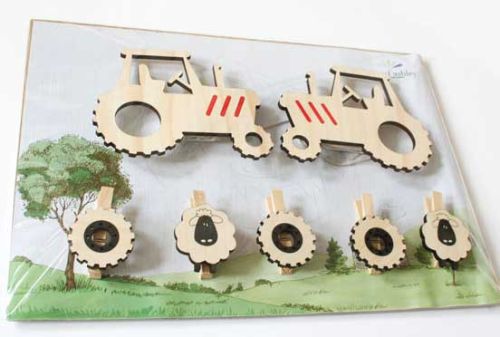 Tractor-shaped art pegs for displaying kids' artwork, crafted from eco-friendly pine veneer, ready to hang in style.
