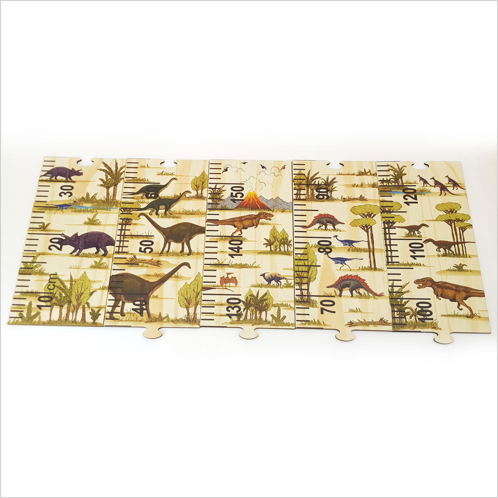Colorful dinosaur-themed growth chart ruler made of eco-friendly pine veneer, featuring interactive puzzle pieces for kids.