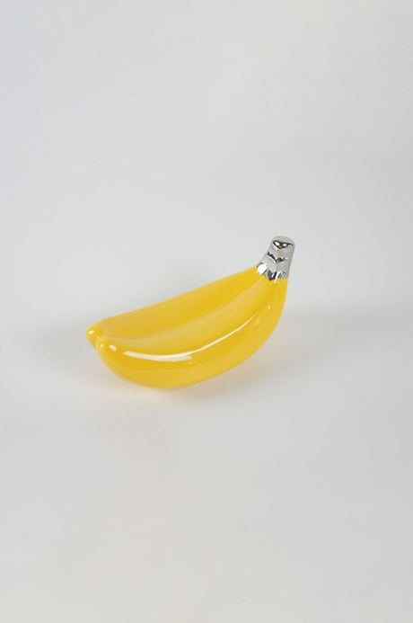 Vibrant yellow and silver ceramic banana decor piece, measuring 14.5 x 6.5 x 7.0 cm, perfect for modern home accents.