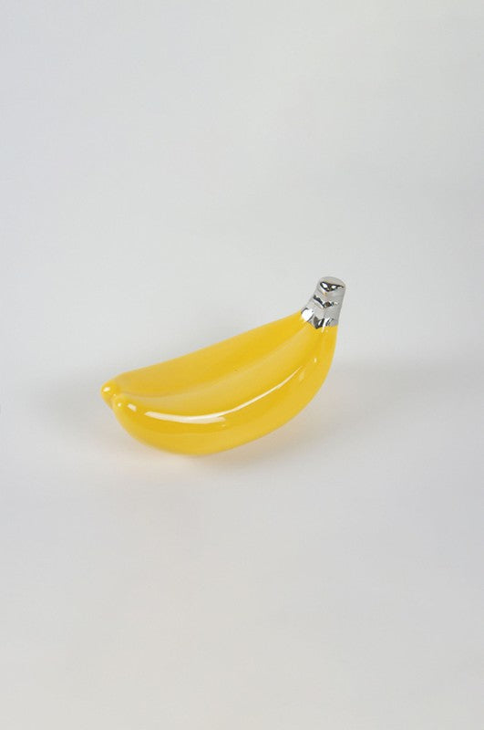 Vibrant yellow and silver ceramic banana decor piece, measuring 14.5 x 6.5 x 7.0 cm, perfect for modern home accents.