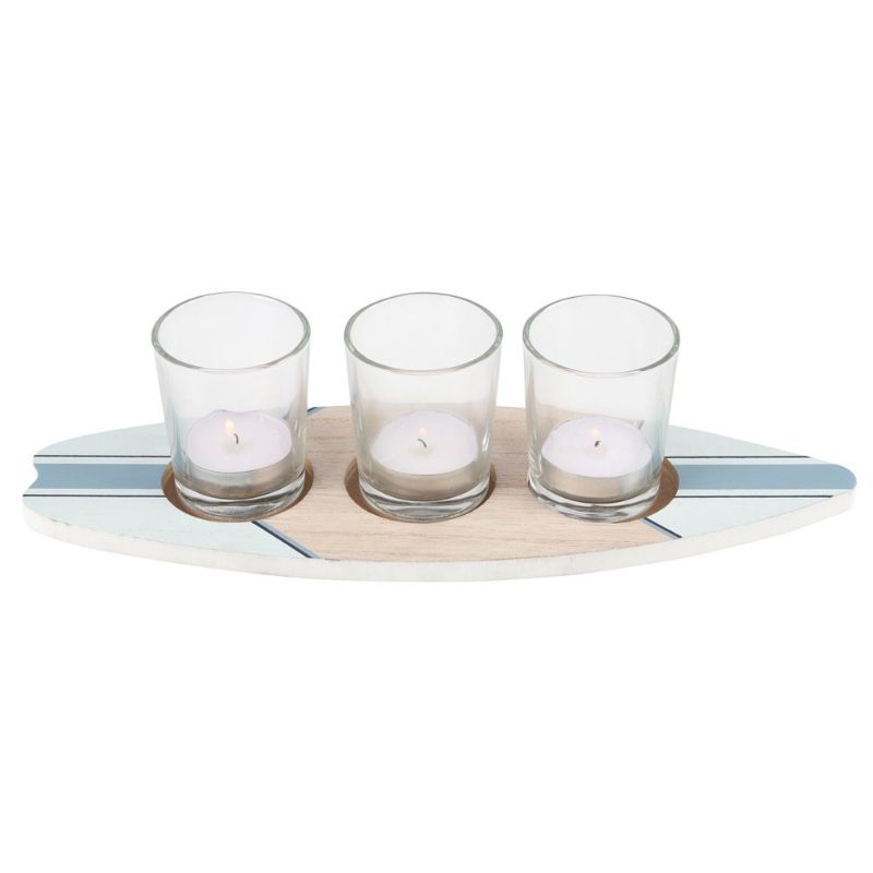 Surfboard-shaped tealight holder for three candles, perfect for coastal decor and creating a cozy atmosphere.