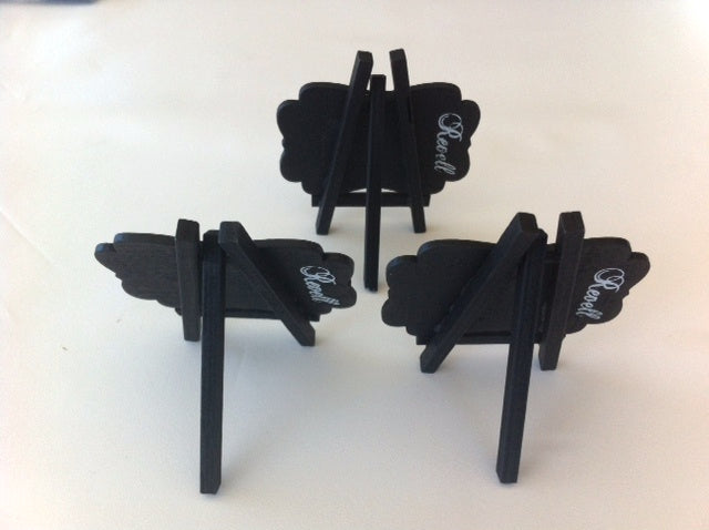 Three small black easels with blackboards, ideal for displaying messages and decor at events, measuring 8cm x 7cm.
