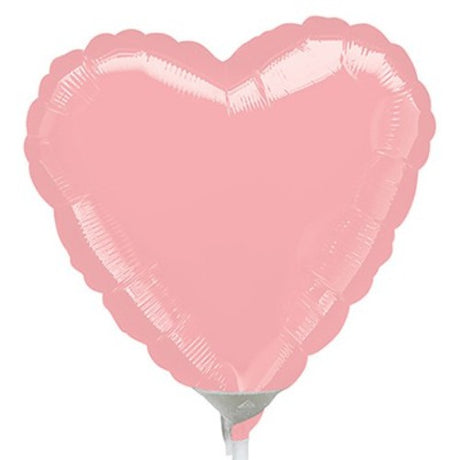 10cm heart-shaped pastel pink foil balloon, perfect for parties and celebrations, requiring air inflation and heat sealing.