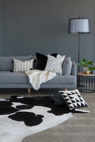 Small black and white Meadow Cowhide rug, 160x210cm, showcasing unique patterns for stylish home decor.