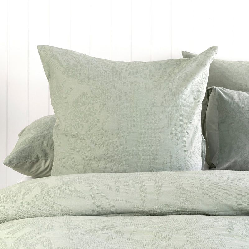 Karridale Euro Pillowcase in light sage green, featuring a luxurious jacquard leaf pattern and smooth cotton percale reverse.