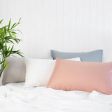 Luxurious rose pink bamboo satin pillowcases for soft, breathable comfort, reducing hair breakage and enhancing sleep quality.