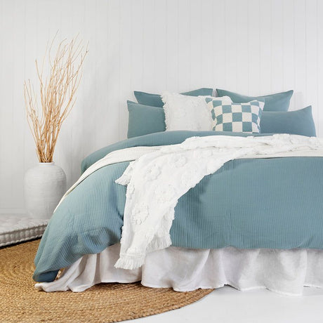 Double duvet cover in steel blue, featuring quilted fine lines and soft cotton percale for a cozy, elegant bedroom transformation.