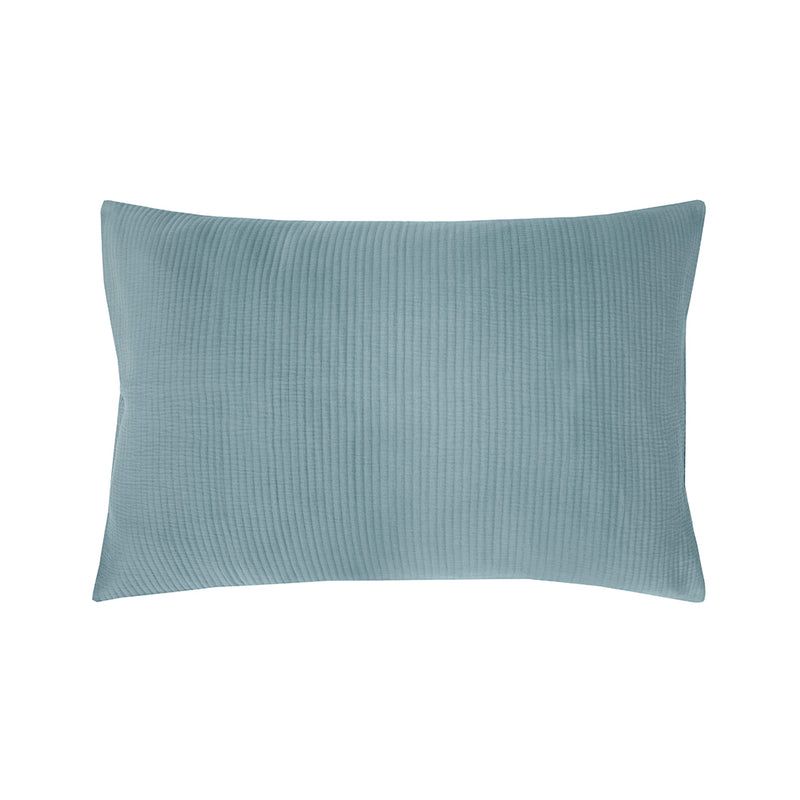 Double duvet cover in steel blue, featuring fine quilted lines and soft cotton percale backing for comfort and elegance.