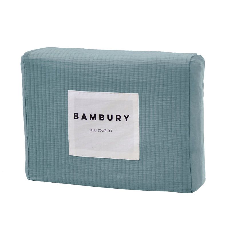 Double duvet cover in steel blue with fine quilted texture, crafted from soft cotton for comfort and elegance.