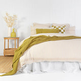 King Duvet Cover - Molloy Quilt Set in warm earthy tones with woven stripes, crafted from soft cotton gauze for a cozy bedroom.