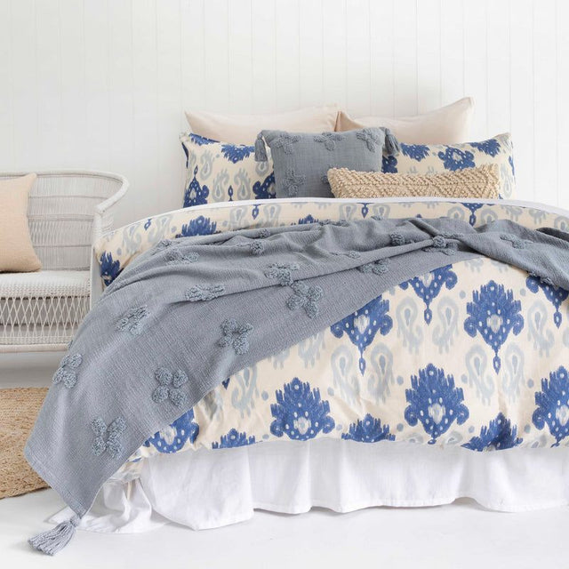 Queen duvet cover set featuring a blue paisley ikat design on linen cotton for a stylish and cozy bedroom transformation.