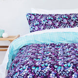 King Duvet Cover Set Evelyn featuring vibrant hand-painted florals in aqua green, purple, and blue on luxurious cotton sateen.