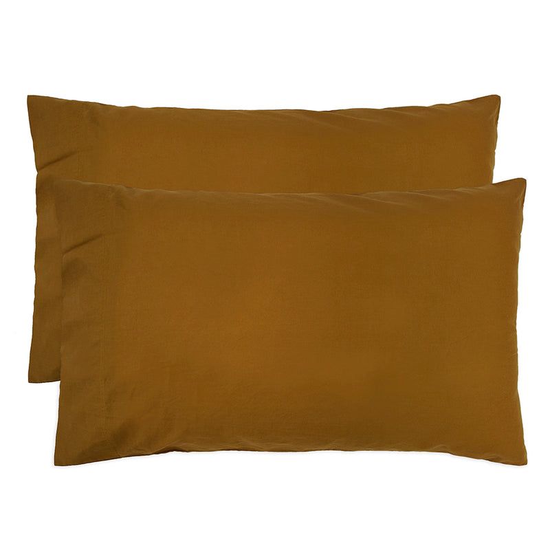 Luxurious tobacco-colored organic cotton pillowcase pair with refined borders, enhancing comfort and sustainability for restful sleep.