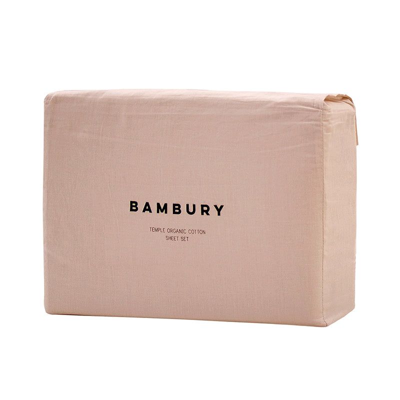 Luxurious organic cotton king sheet set in ivory, featuring soft vintage-washed fabric and eco-friendly certifications.