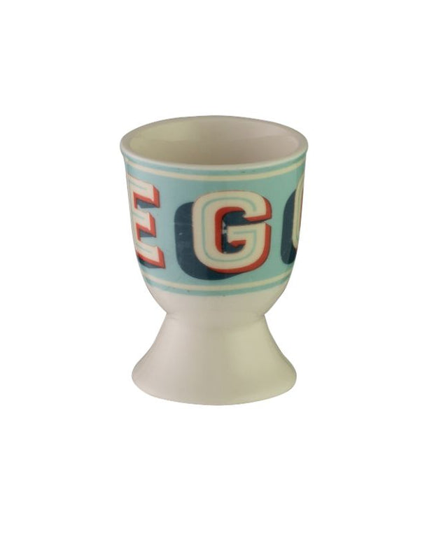 Vintage-style egg cup featuring playful bunny designs, crafted from durable stoneware for fun family breakfasts.