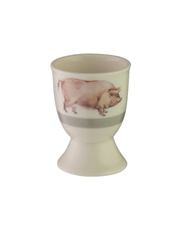 Whimsical Avanti Pig Egg Cup, crafted from durable stoneware, perfect for serving boiled eggs in a fun, stable design.