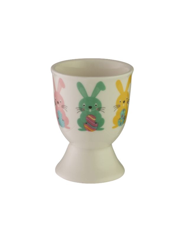 Charming Avanti egg cup featuring bunny faces and colorful eggs, crafted from durable stoneware for festive breakfasts.