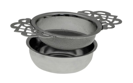 Elegant stainless steel tea strainer with lace handles and drip tray, perfect for brewing loose leaf teas in style.