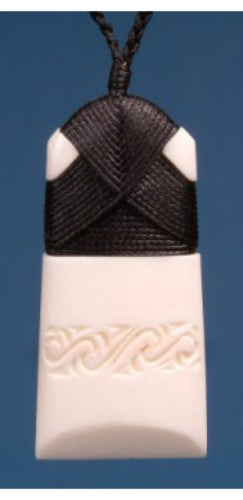 Engraved small toki pendant made from bone, symbolizing strength and courage, featuring an adjustable cord.