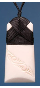 Small bone toki pendant on adjustable cord, celebrating M?ori strength and courage with unique carvings reflecting Kiwiana.