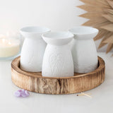 Elegant white ceramic oil burner shaped like a butterfly, perfect for melting wax and infusing spaces with calming scents.