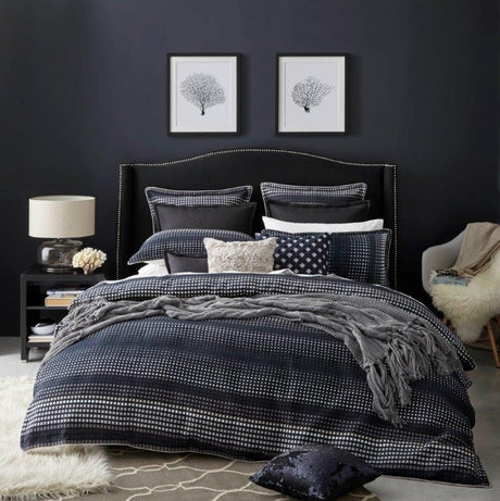 Elegant Benson Navy Queen Duvet Set with pixelated pattern, ivory piping, and luxurious comfort by Logan & Mason.