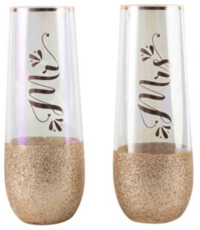 Elegant stemless champagne glasses with glitter accents, perfect for toasting at weddings or special occasions.