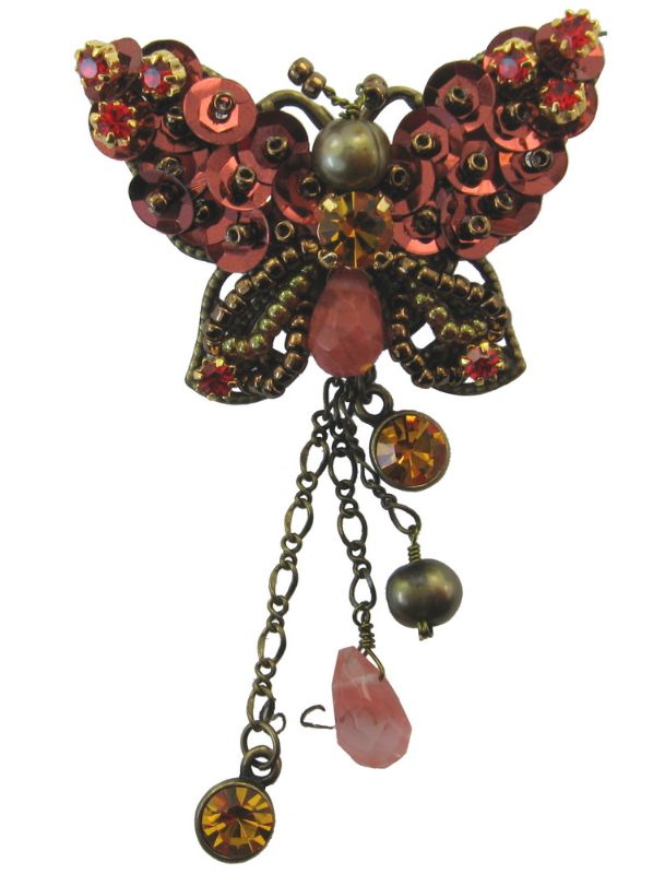 Elegant black butterfly brooch with intricate detailing, perfect for enhancing any outfit with sophistication.
