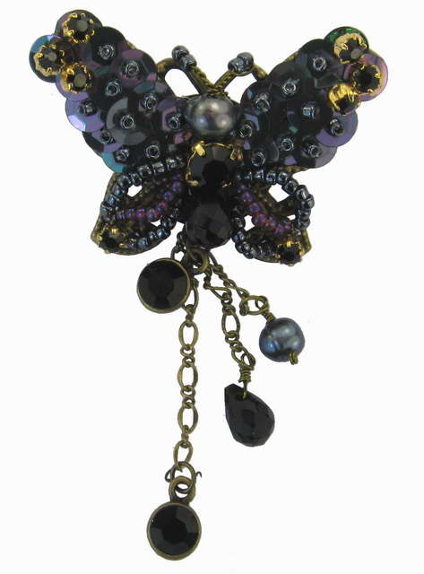 Elegant red butterfly brooch featuring vibrant enamel and intricate detail, perfect for enhancing any outfit.