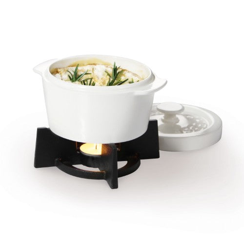 Small oven dish for baking and serving soft cheeses warm and dippable, perfect for entertaining and adding delicious toppings.