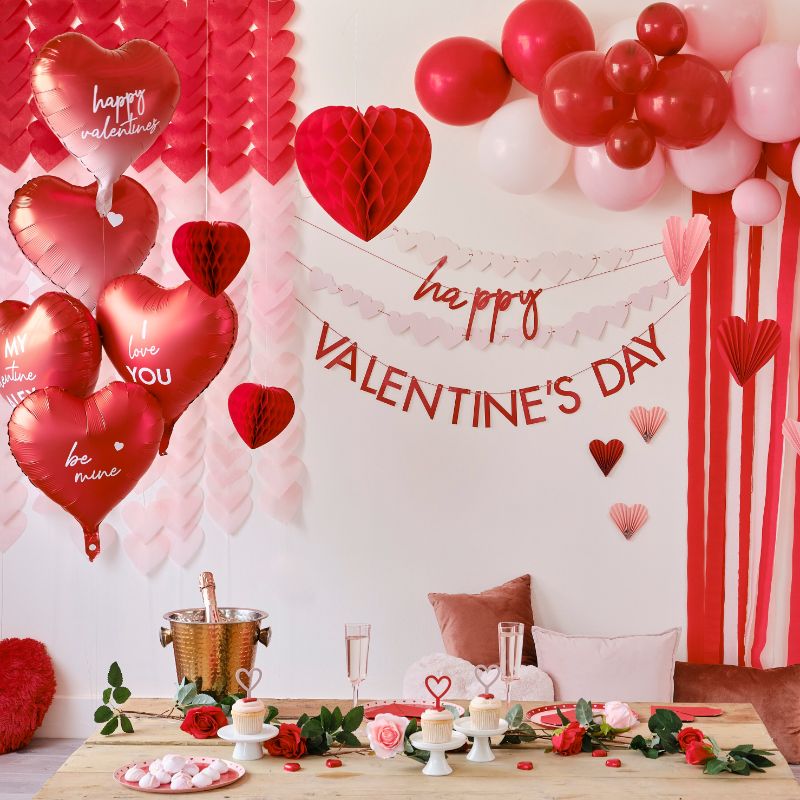 Colorful Valentine's balloon bundle with confetti hearts and "Happy Valentine's Day" messages for a romantic celebration.