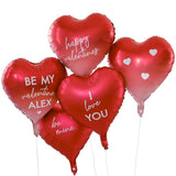 Heart-shaped foil balloons in red and ombré, customizable with stickers for Valentine's Day messages, eco-friendly packaging.