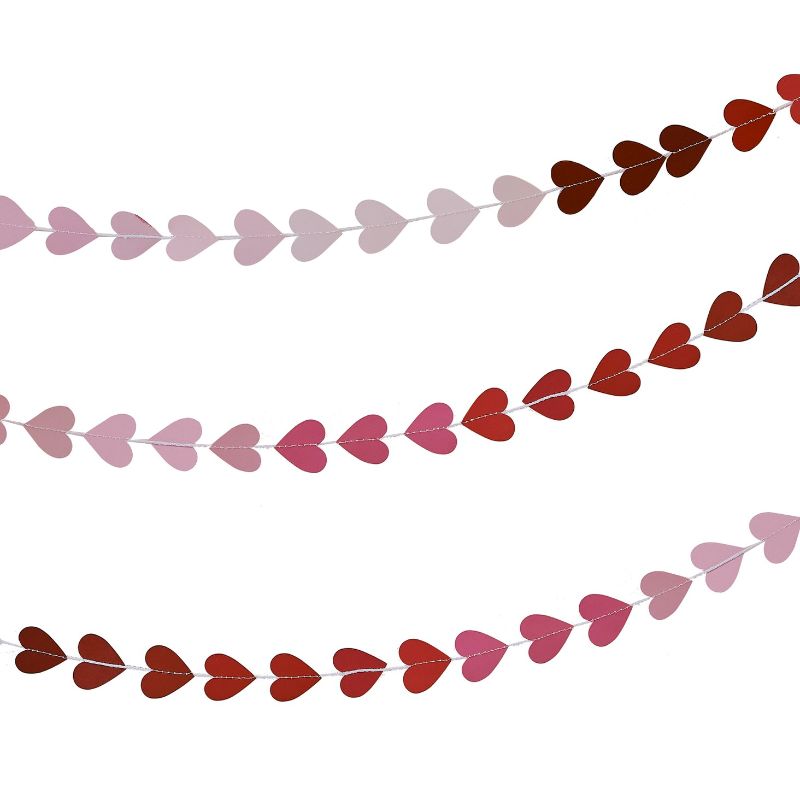 Ombré heart garland in pink to red hues, perfect for Valentine's Day celebrations, made from fully recyclable materials.