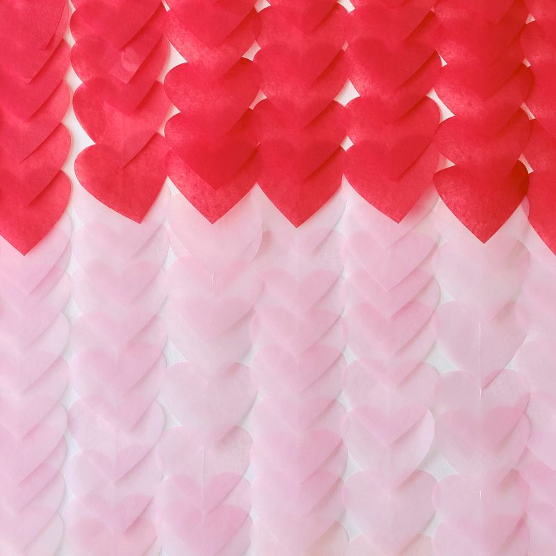 Romantic ombré heart backdrop with 24 red, pink, and light pink hearts, perfect for Valentine's Day celebrations.