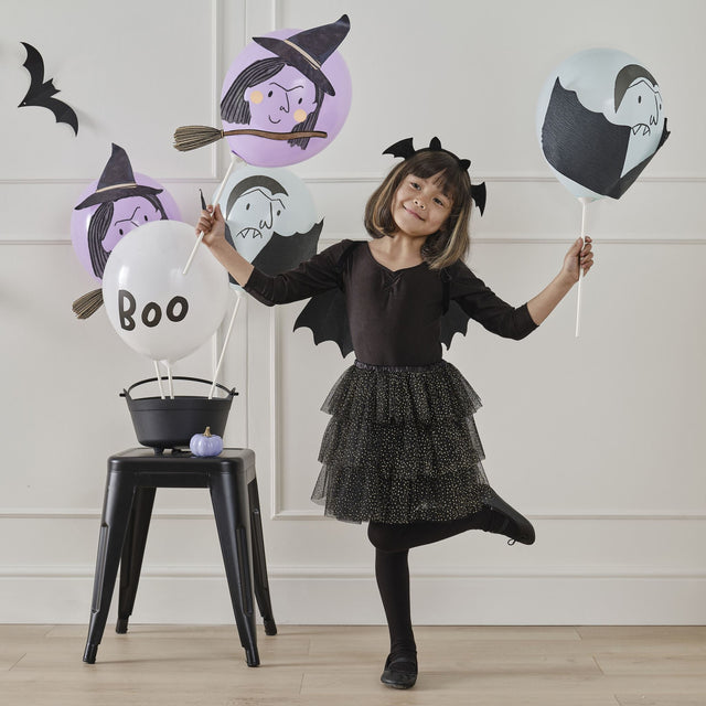 Whimsical Halloween balloon set featuring vampire and witch designs, perfect for party decor and trick-or-treating fun.