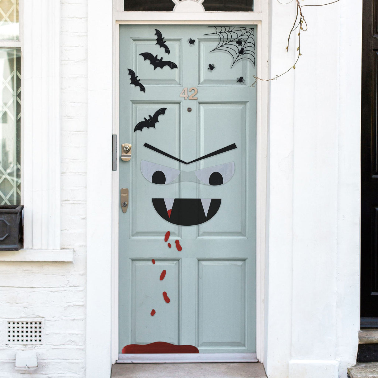 Vibrant Halloween door stickers featuring a spooky vampire, bats, spiders, and blood drips for festive decor.