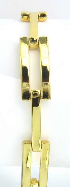 Gold link bracelet featuring a classic design, adjustable fit, and elegant finish for any occasion.