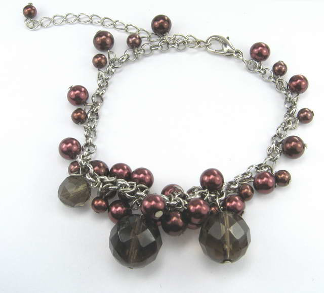 Brown bead and crystal bracelet featuring shimmering crystals and earthy tones, perfect for any occasion.